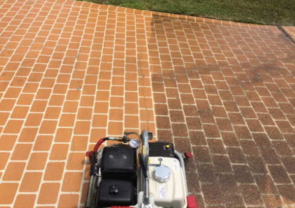 A Geelong driveway halfway through a pressure wash showing one half pressured cleaned, the other half still to be washed.